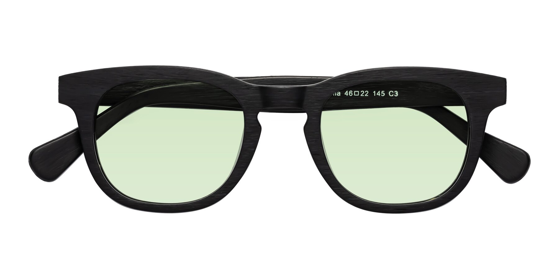 Folded Front of Tonia in Black Woodgrain with Light Green Tinted Lenses