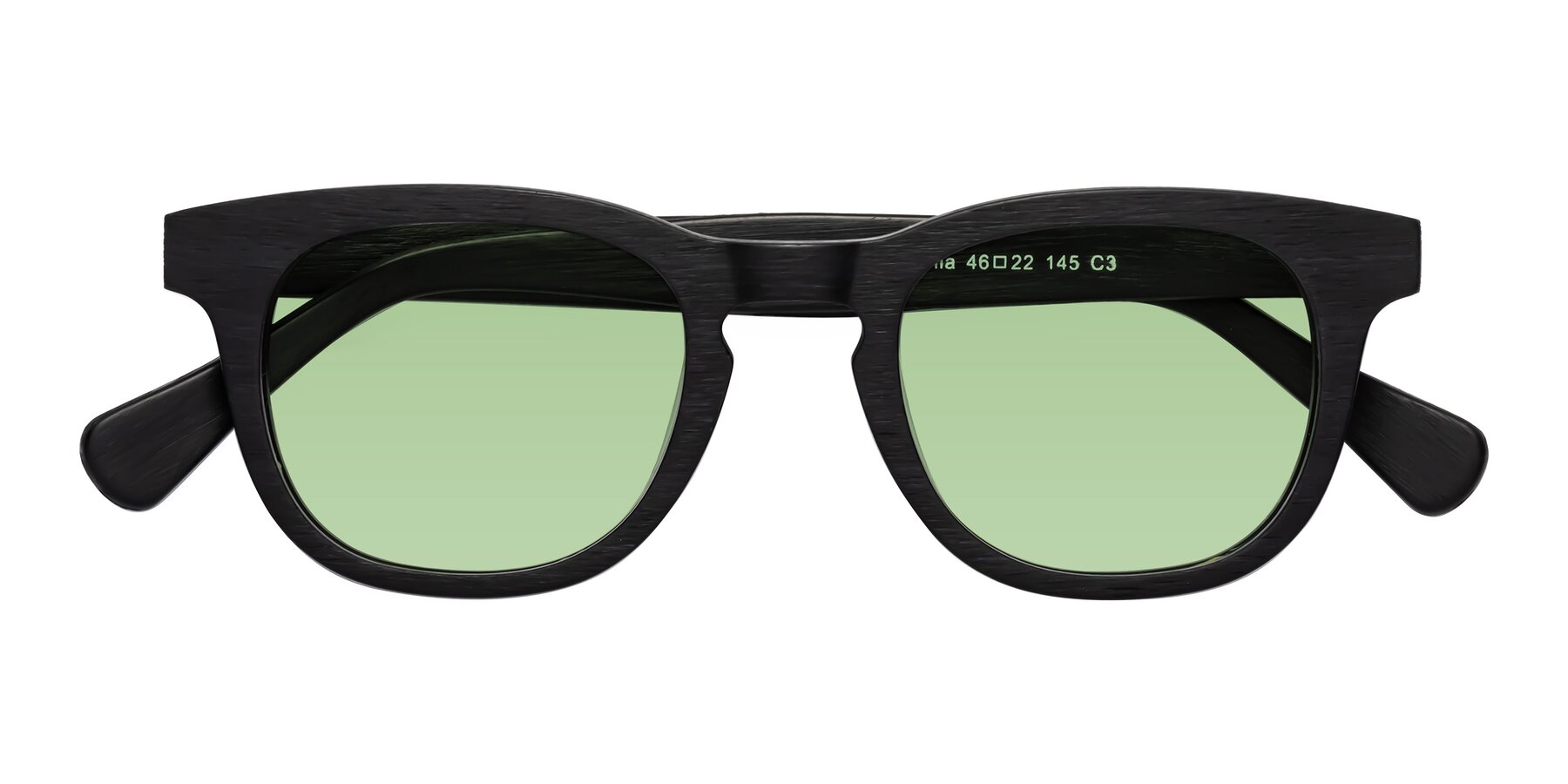 Folded Front of Tonia in Black Woodgrain with Medium Green Tinted Lenses