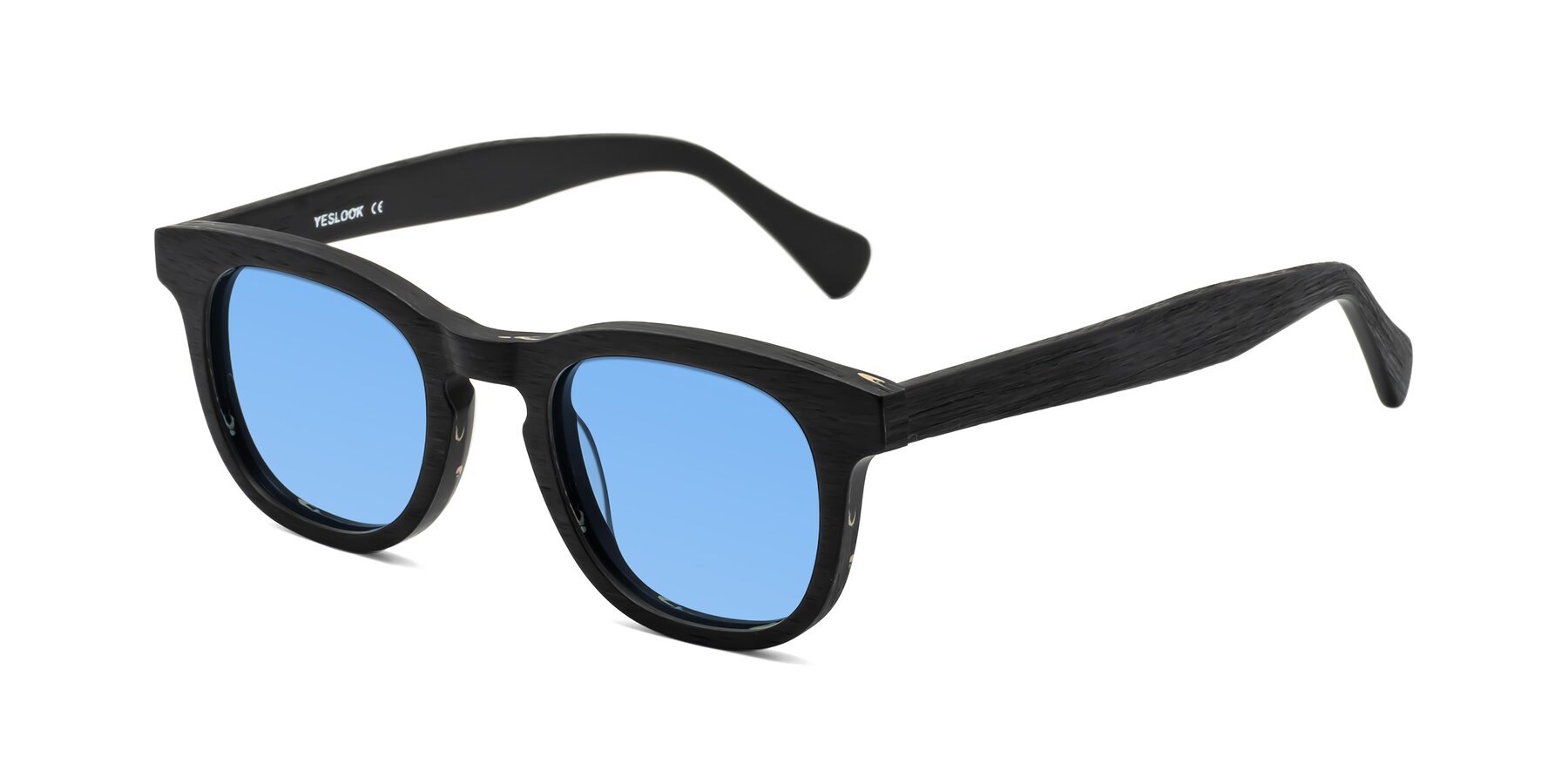 Angle of Tonia in Black Woodgrain with Medium Blue Tinted Lenses