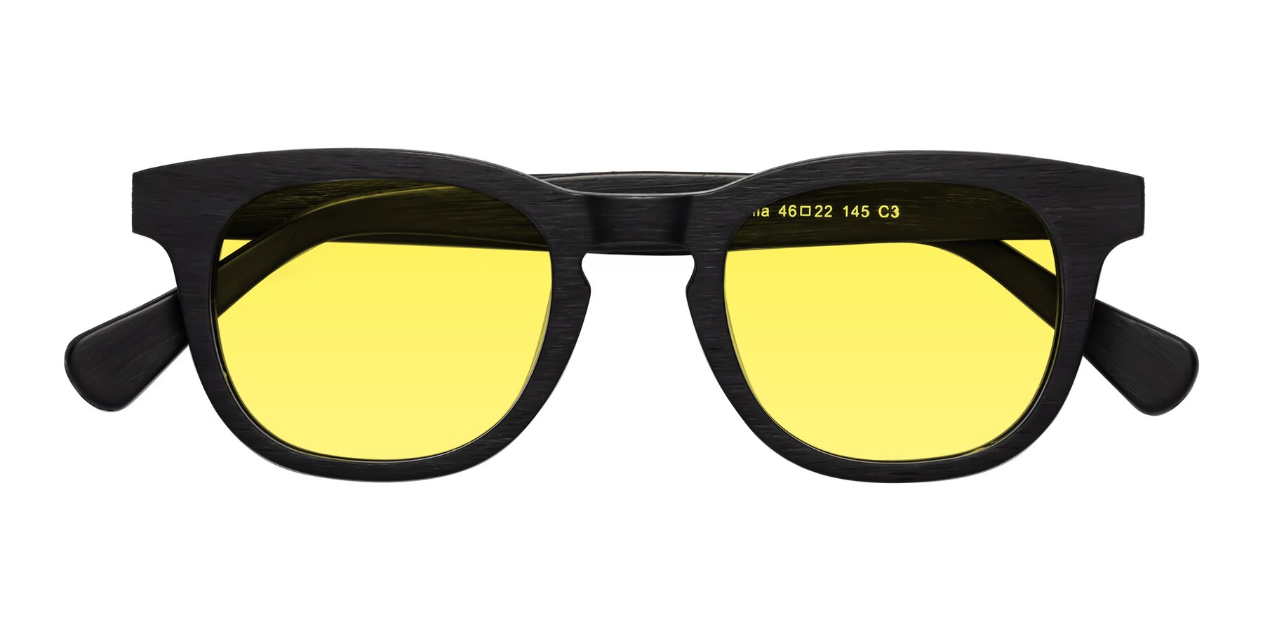 Folded Front of Tonia in Black Woodgrain with Medium Yellow Tinted Lenses