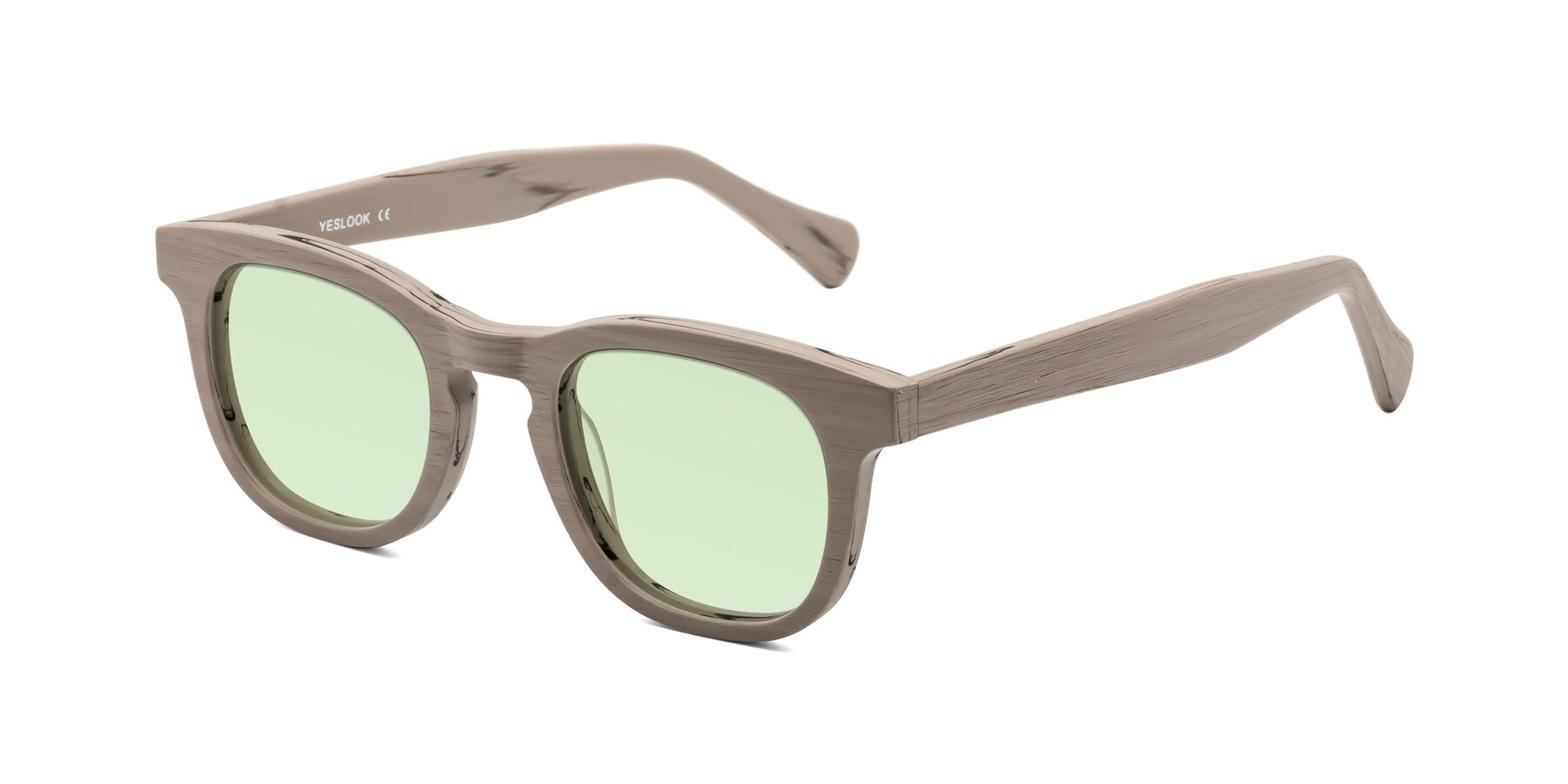 Angle of Tonia in Pale Mauve Woodgrain with Light Green Tinted Lenses