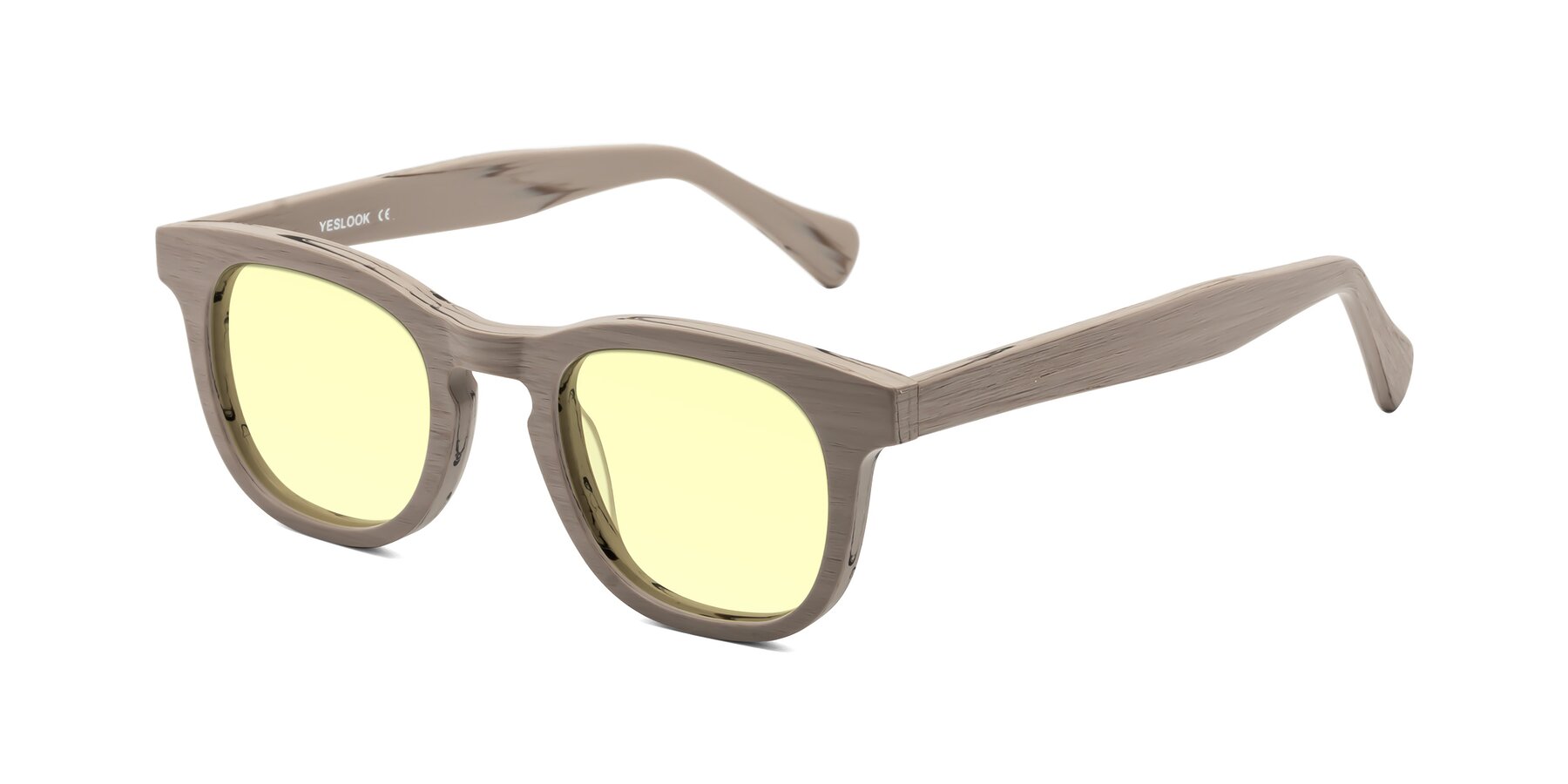 Angle of Tonia in Pale Mauve Woodgrain with Light Yellow Tinted Lenses