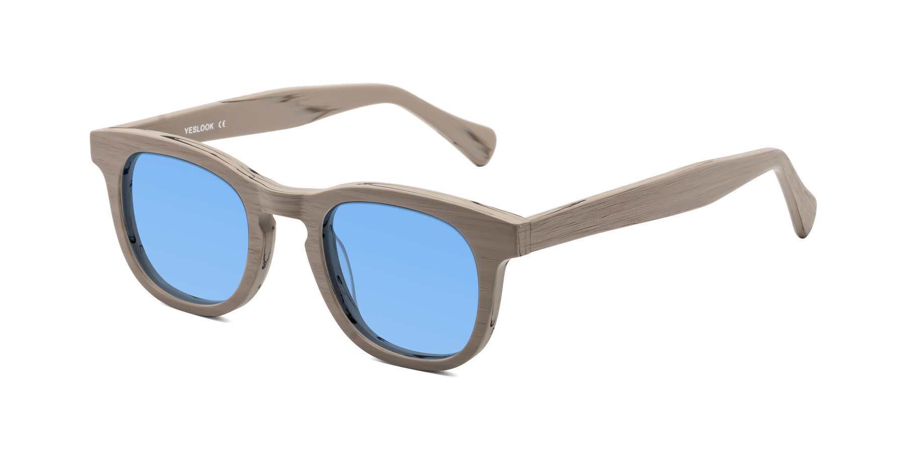 Angle of Tonia in Pale Mauve Woodgrain with Medium Blue Tinted Lenses