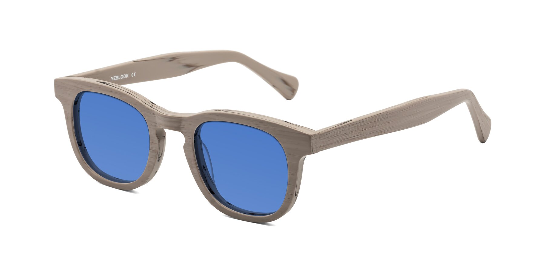 Angle of Tonia in Pale Mauve Woodgrain with Blue Tinted Lenses