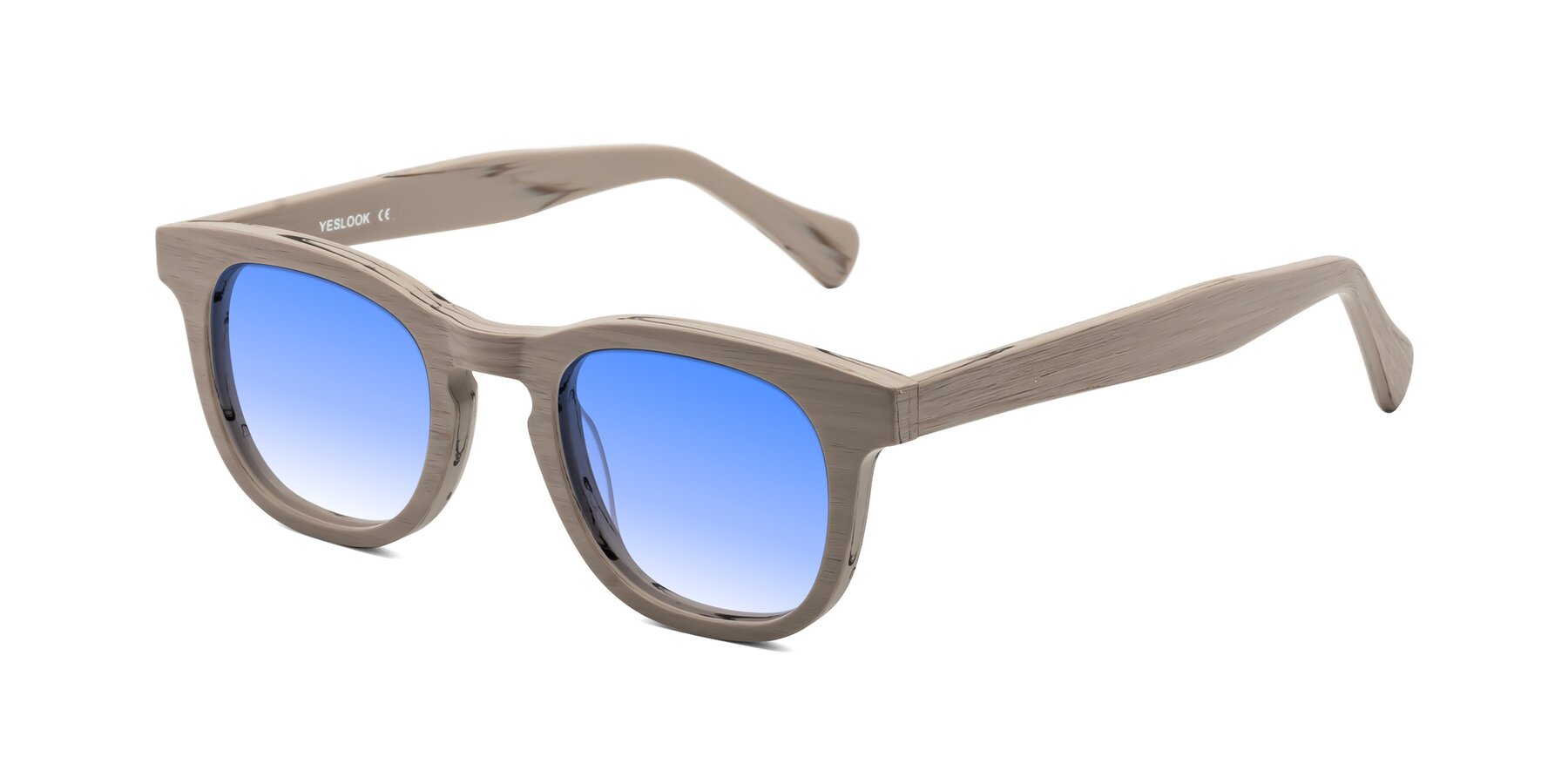 Angle of Tonia in Pale Mauve Woodgrain with Blue Gradient Lenses