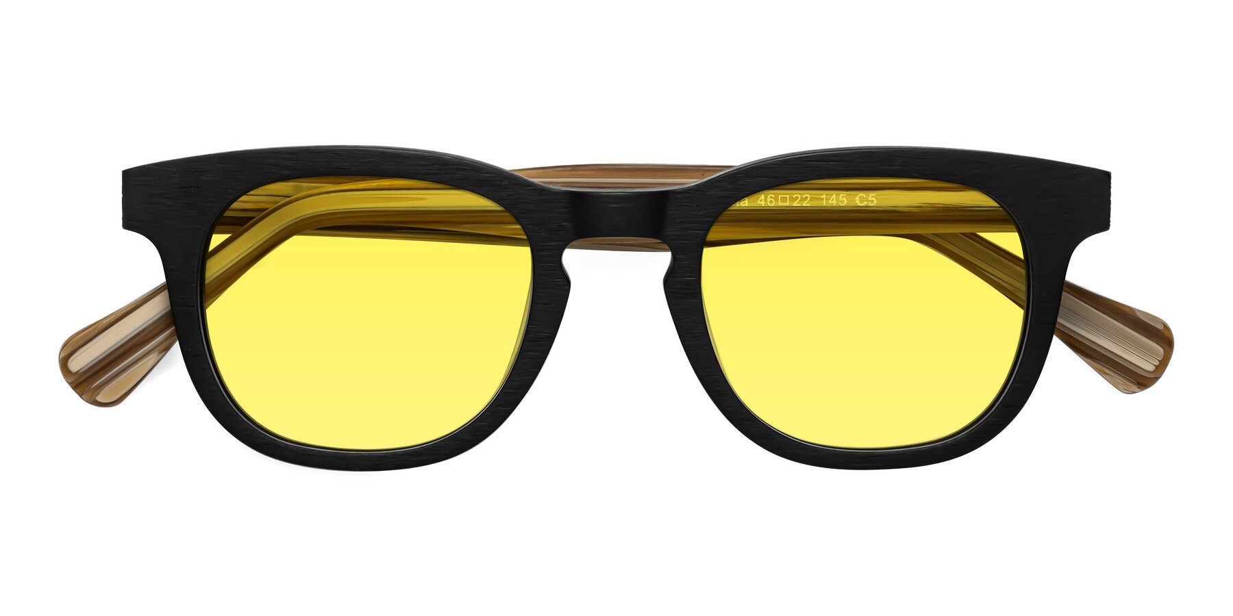 Folded Front of Tonia in Black-Sugar Woodgrain with Medium Yellow Tinted Lenses