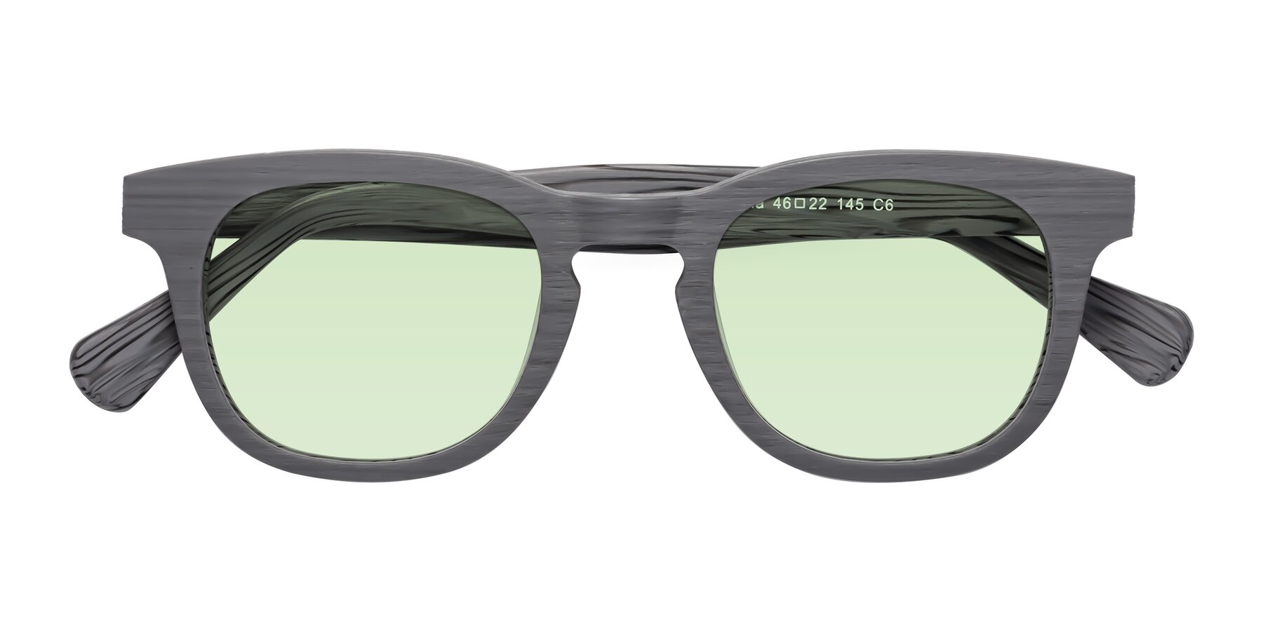 Folded Front of Tonia in Cement Woodgrain with Light Green Tinted Lenses