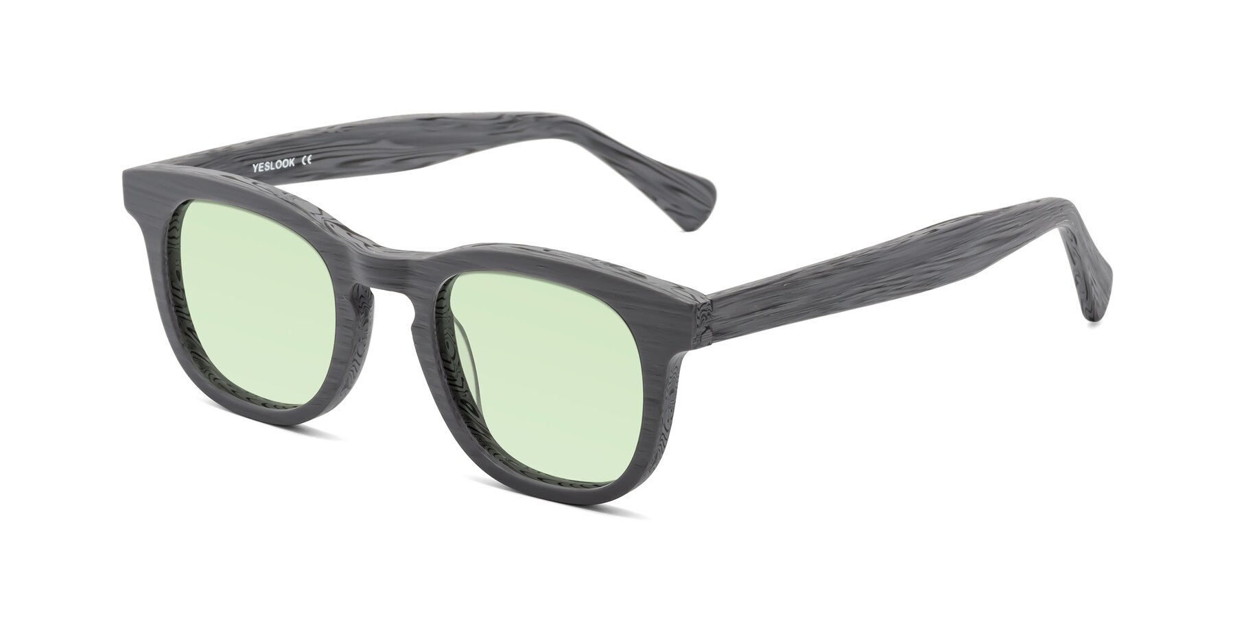 Angle of Tonia in Cement Woodgrain with Light Green Tinted Lenses