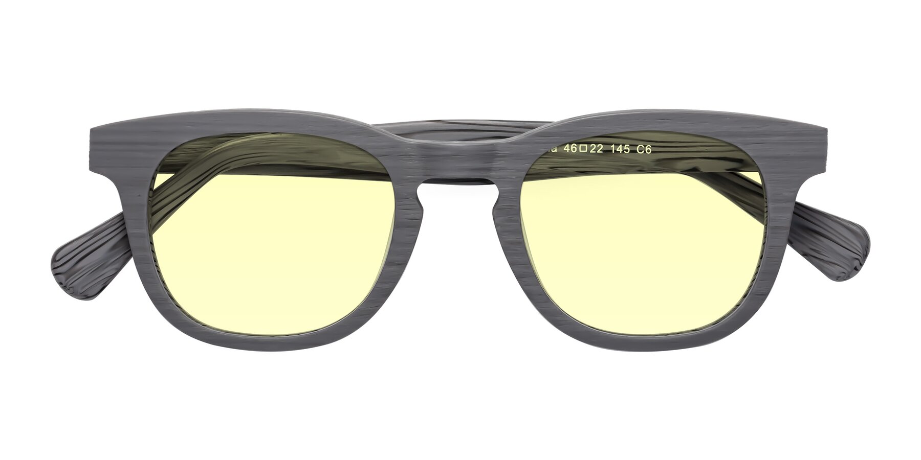 Folded Front of Tonia in Cement Woodgrain with Light Yellow Tinted Lenses