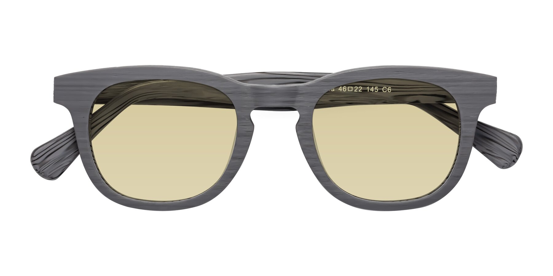 Folded Front of Tonia in Cement Woodgrain with Light Champagne Tinted Lenses