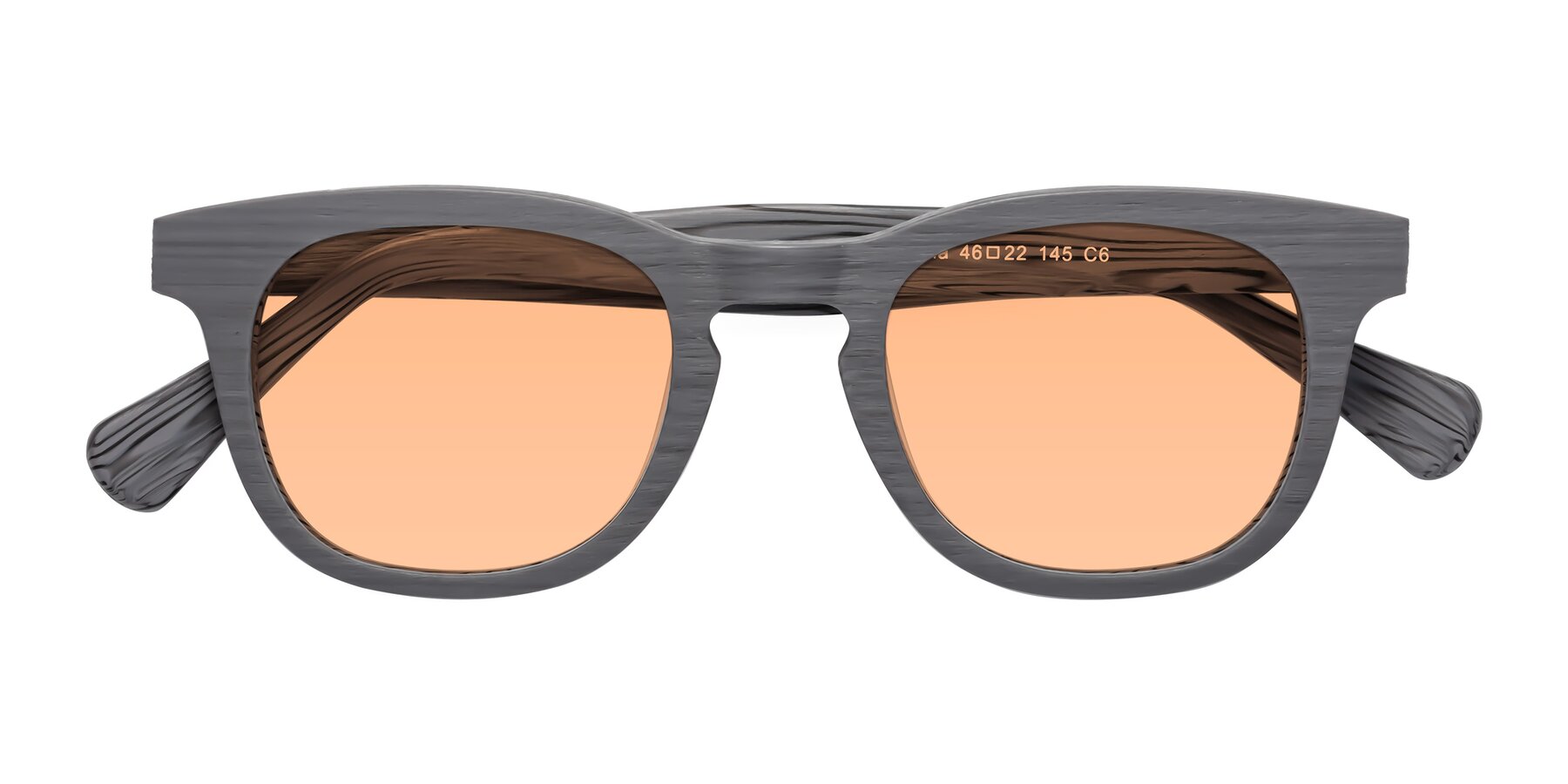 Folded Front of Tonia in Cement Woodgrain with Light Orange Tinted Lenses