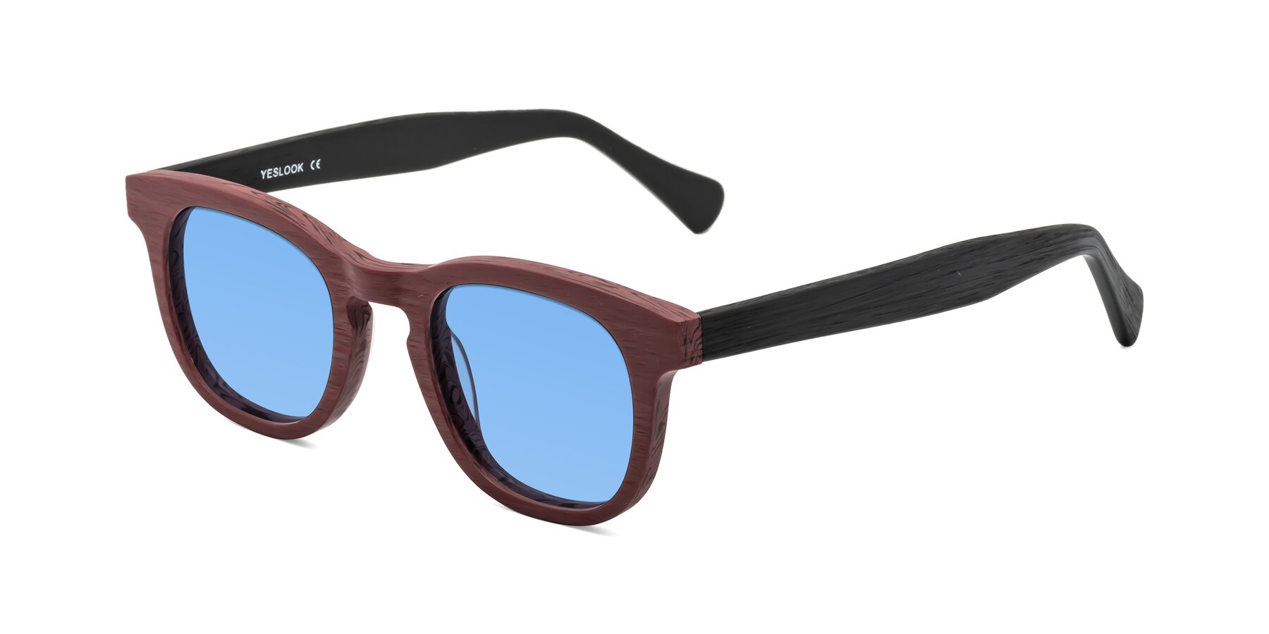 Angle of Tonia in Burgundy-Black Woodgrain with Medium Blue Tinted Lenses