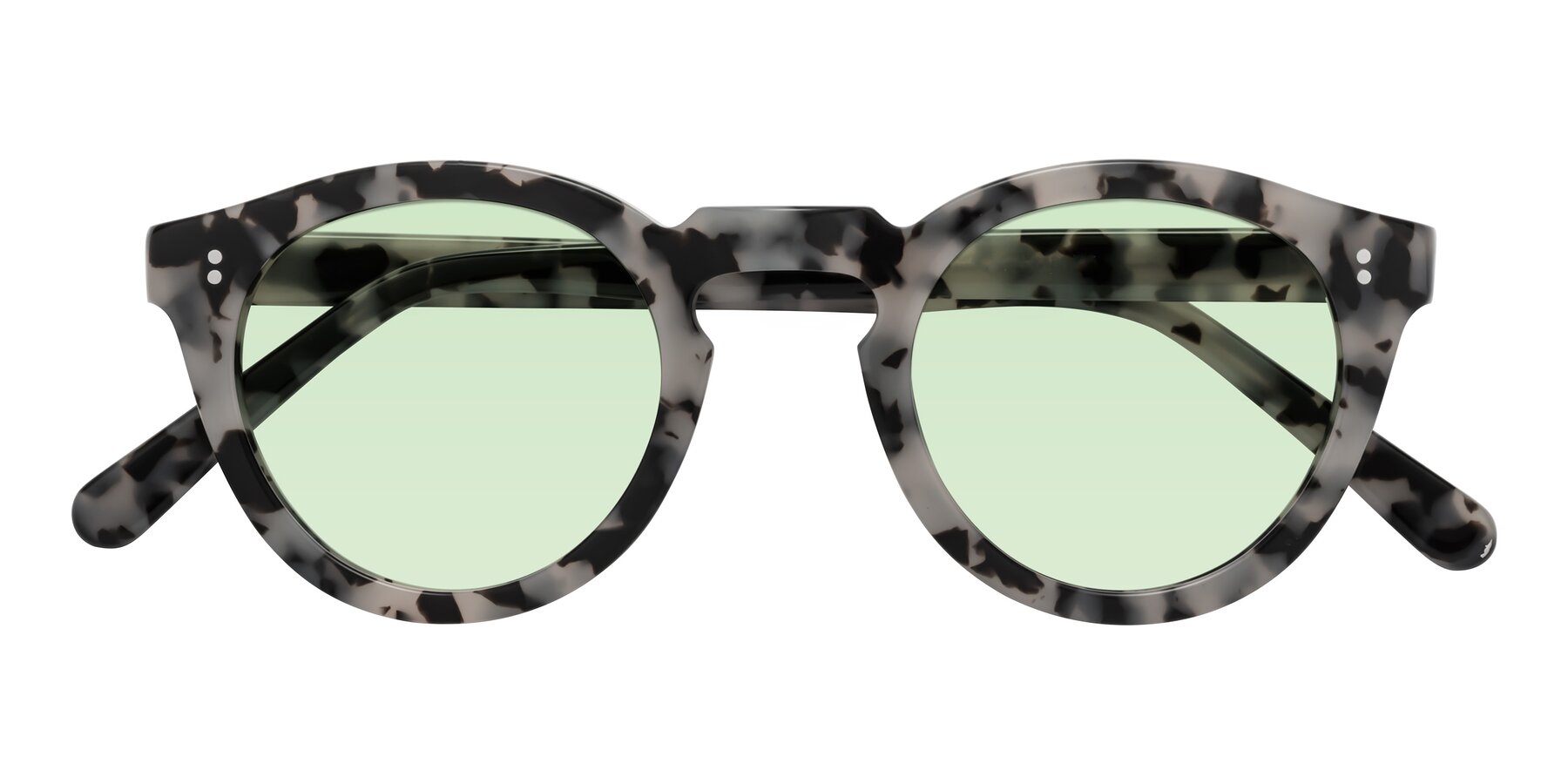 Folded Front of Annie in Ivory Tortoise with Light Green Tinted Lenses