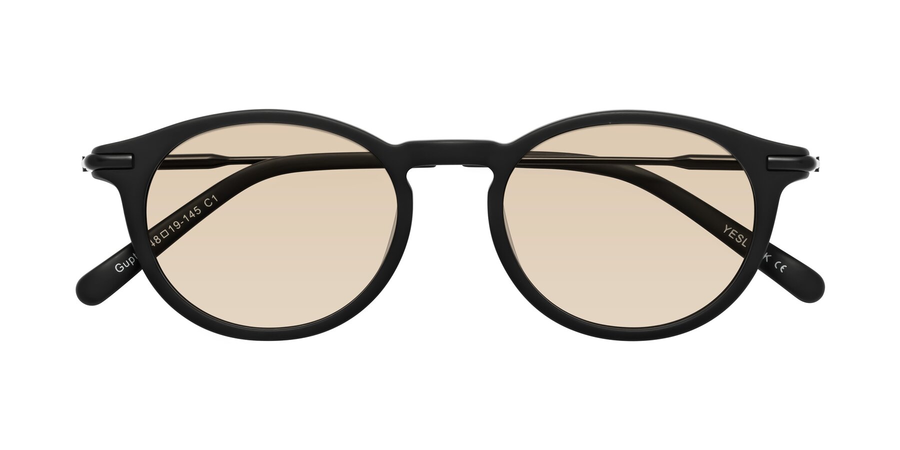 Folded Front of Gupta in Matte Black with Light Brown Tinted Lenses