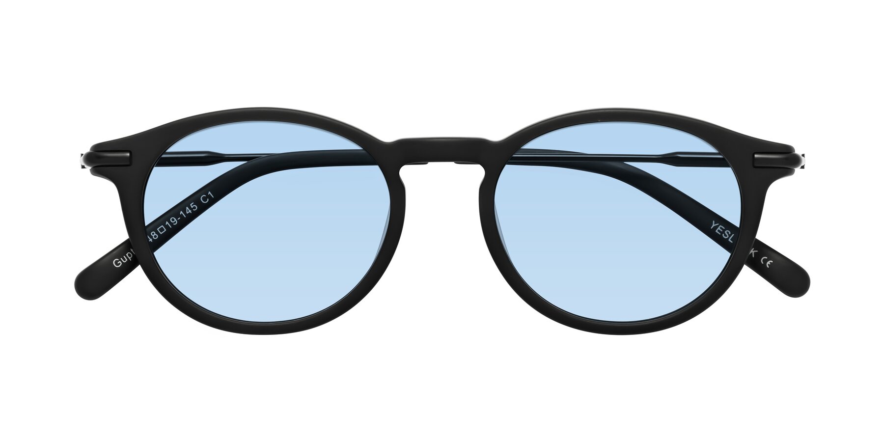 Folded Front of Gupta in Matte Black with Light Blue Tinted Lenses