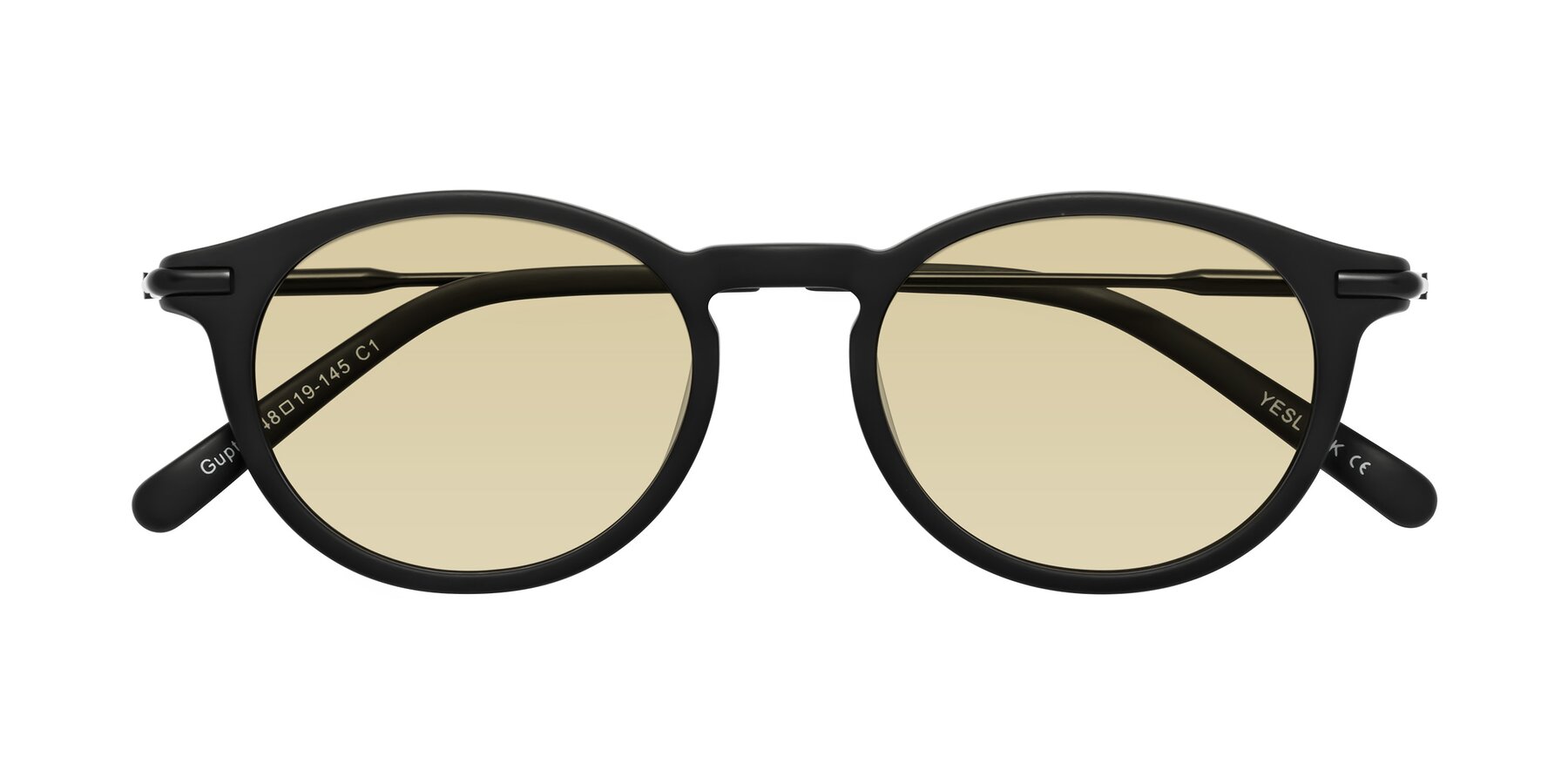 Folded Front of Gupta in Matte Black with Light Champagne Tinted Lenses