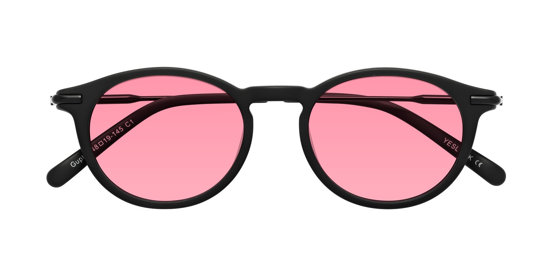 Folded Front of Gupta in Matte Black with Pink Tinted Lenses