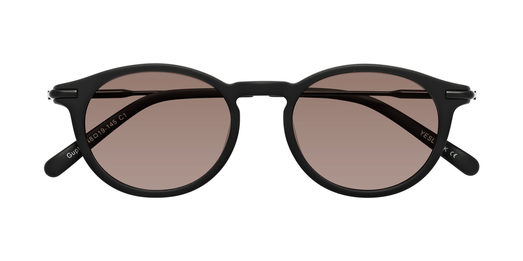 Folded Front of Gupta in Matte Black with Medium Brown Tinted Lenses