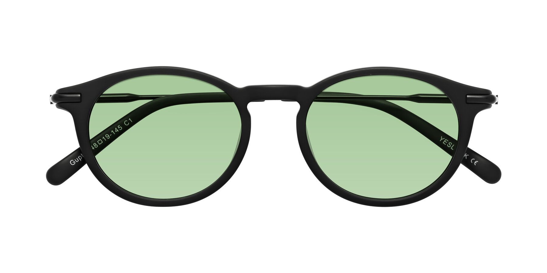Folded Front of Gupta in Matte Black with Medium Green Tinted Lenses