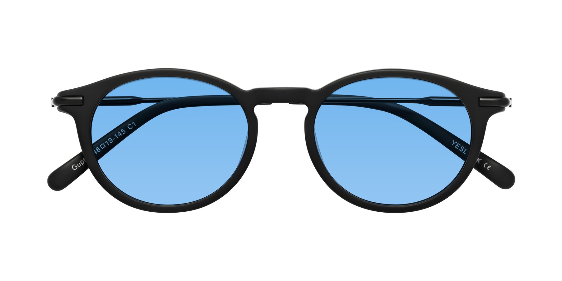 Folded Front of Gupta in Matte Black with Medium Blue Tinted Lenses