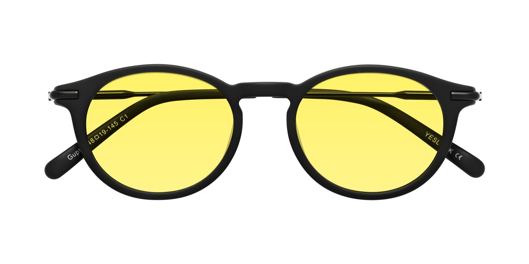 Folded Front of Gupta in Matte Black with Medium Yellow Tinted Lenses