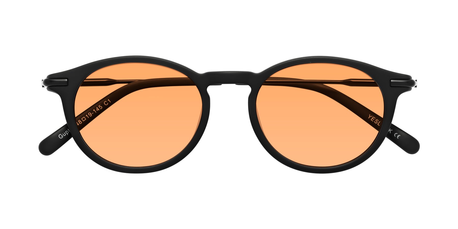Folded Front of Gupta in Matte Black with Medium Orange Tinted Lenses
