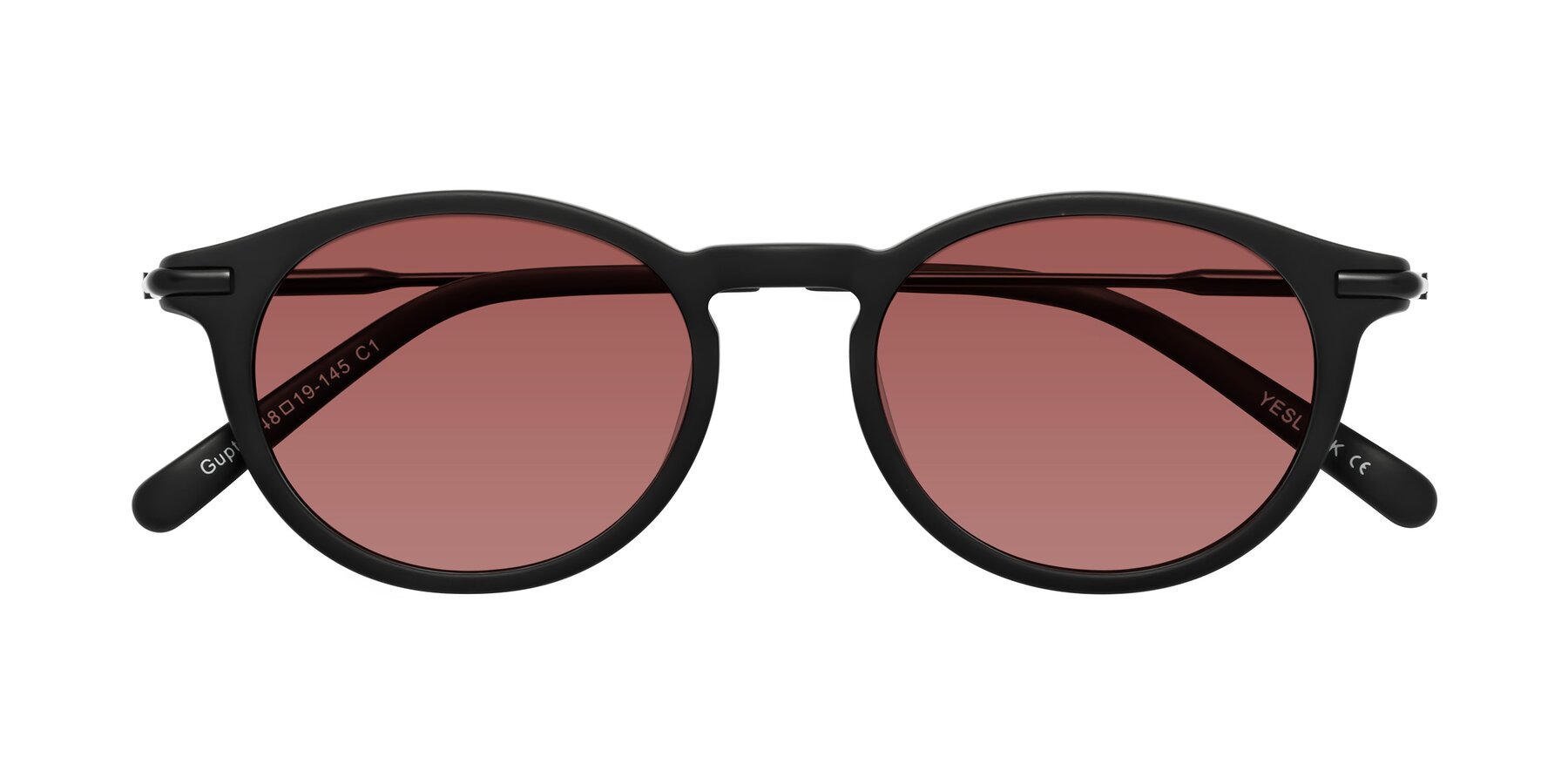 Folded Front of Gupta in Matte Black with Garnet Tinted Lenses