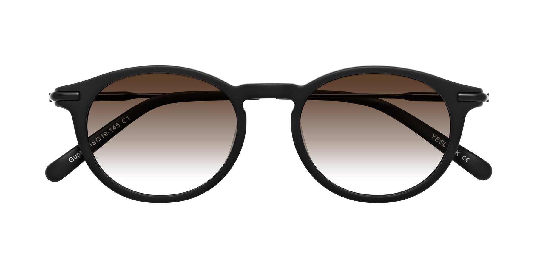 Folded Front of Gupta in Matte Black with Brown Gradient Lenses
