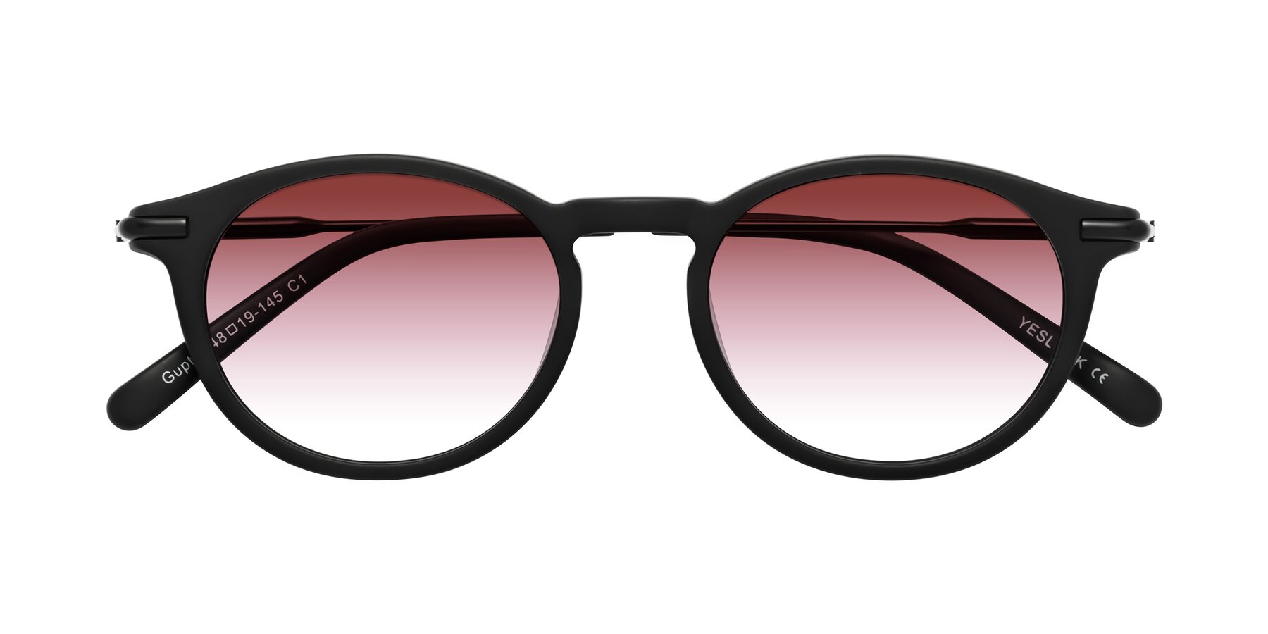Folded Front of Gupta in Matte Black with Garnet Gradient Lenses