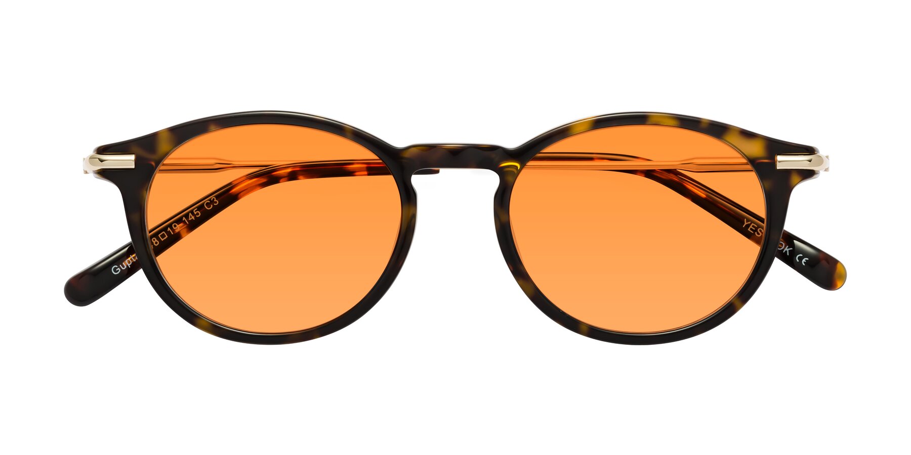 Folded Front of Gupta in Tortoise with Orange Tinted Lenses