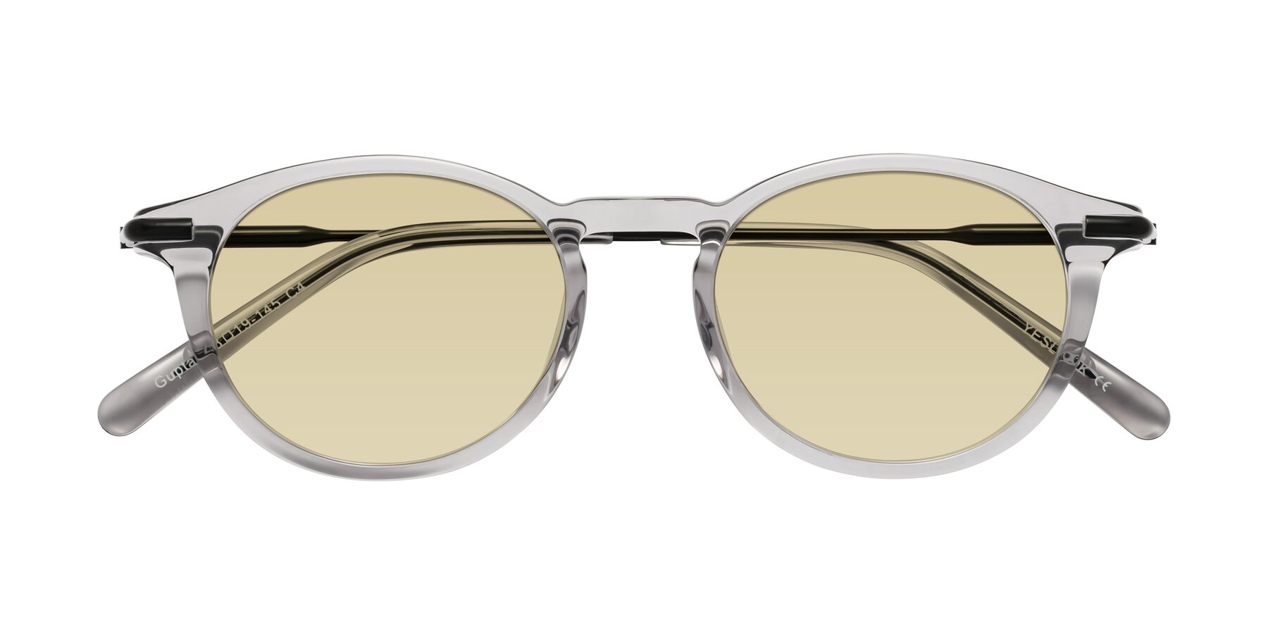 Folded Front of Gupta in Transparent Gray with Light Champagne Tinted Lenses