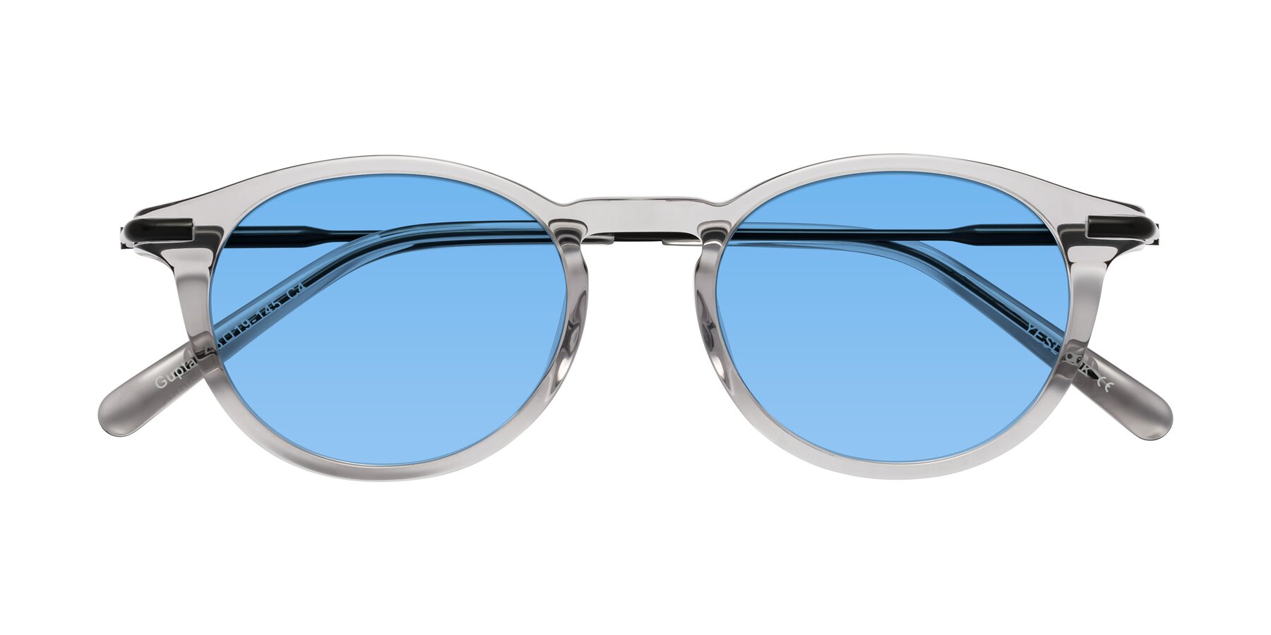 Folded Front of Gupta in Transparent Gray with Medium Blue Tinted Lenses