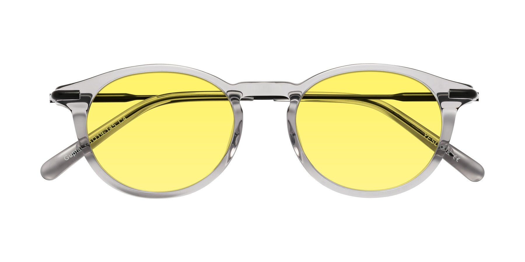 Folded Front of Gupta in Transparent Gray with Medium Yellow Tinted Lenses
