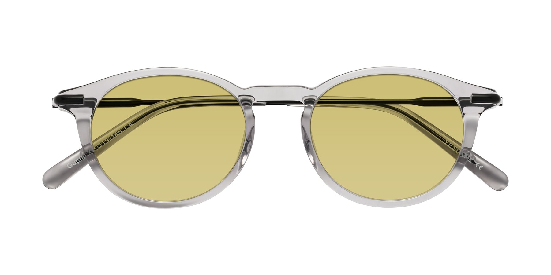 Folded Front of Gupta in Transparent Gray with Medium Champagne Tinted Lenses