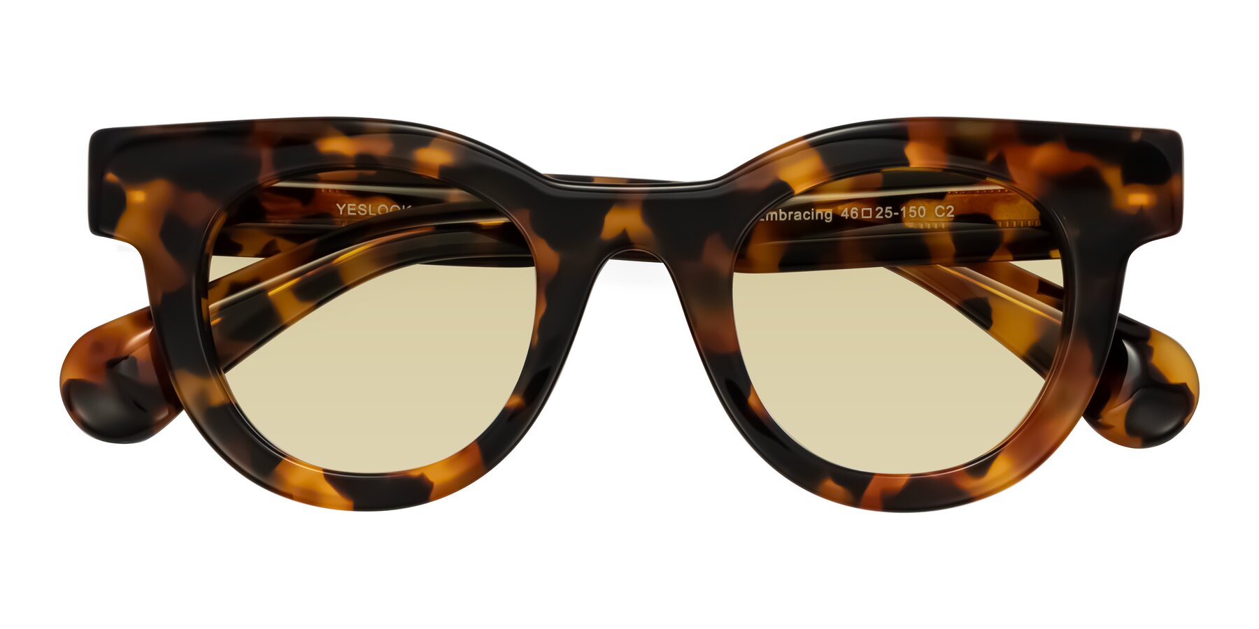 Folded Front of Embracing in Tortoise with Light Champagne Tinted Lenses