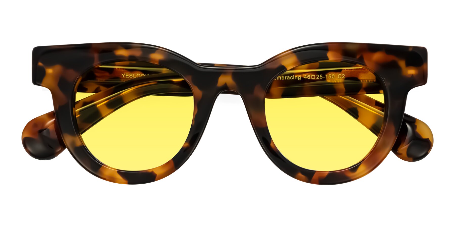 Folded Front of Embracing in Tortoise with Medium Yellow Tinted Lenses