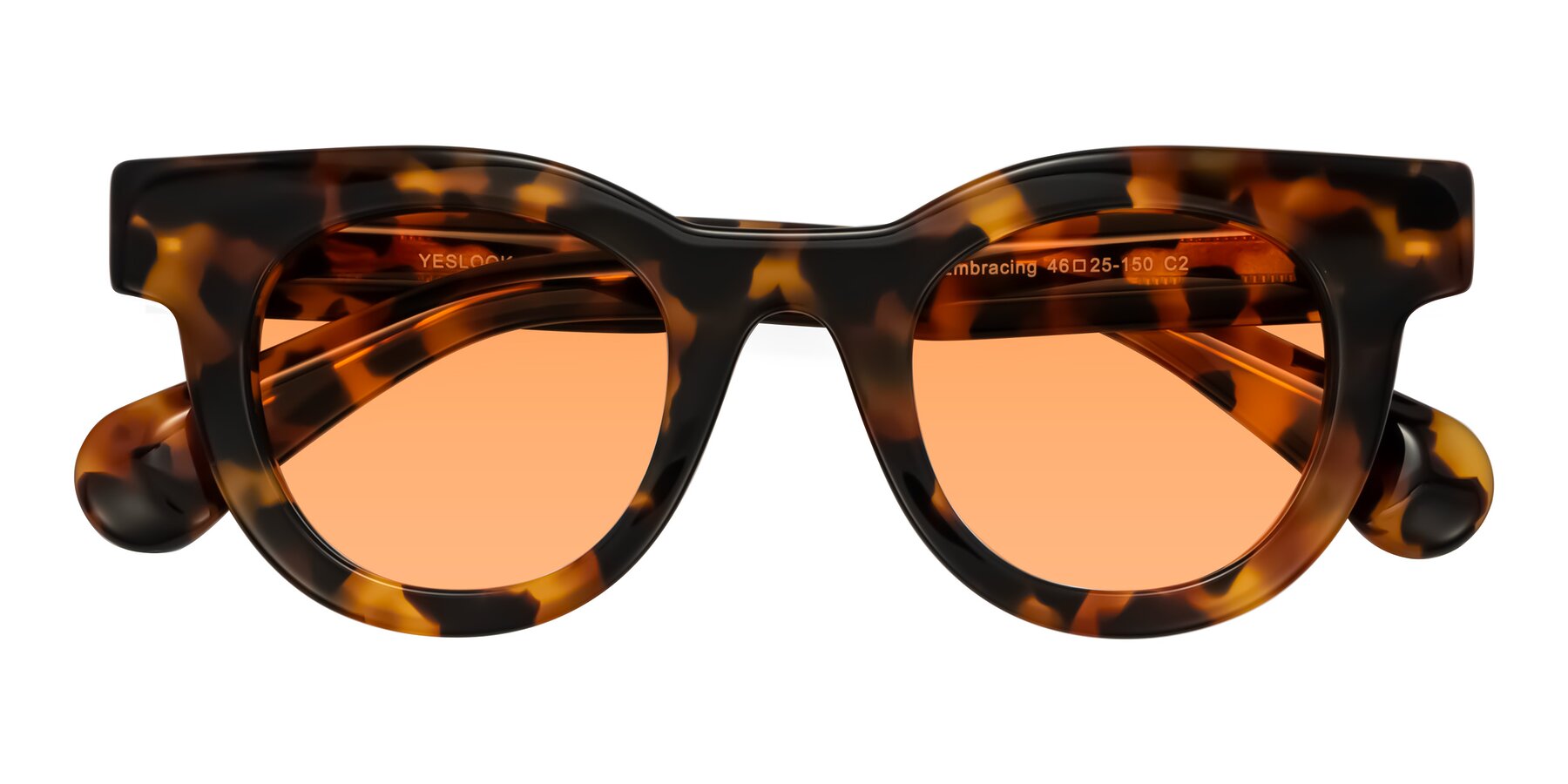 Folded Front of Embracing in Tortoise with Medium Orange Tinted Lenses