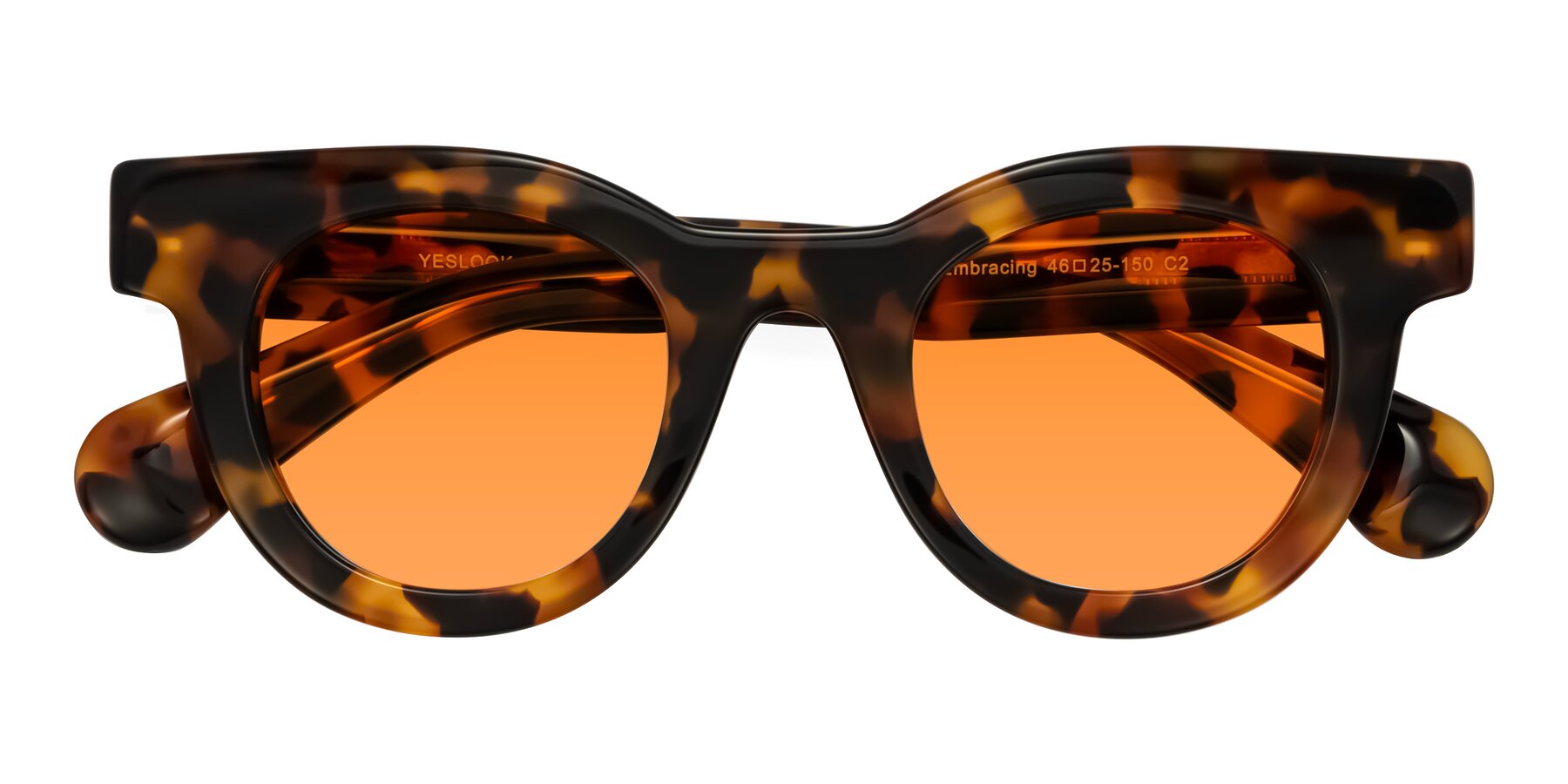 Folded Front of Embracing in Tortoise with Orange Tinted Lenses