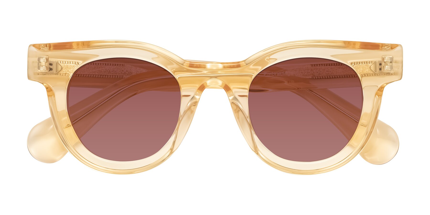 Folded Front of Embracing in Champagne with Garnet Tinted Lenses