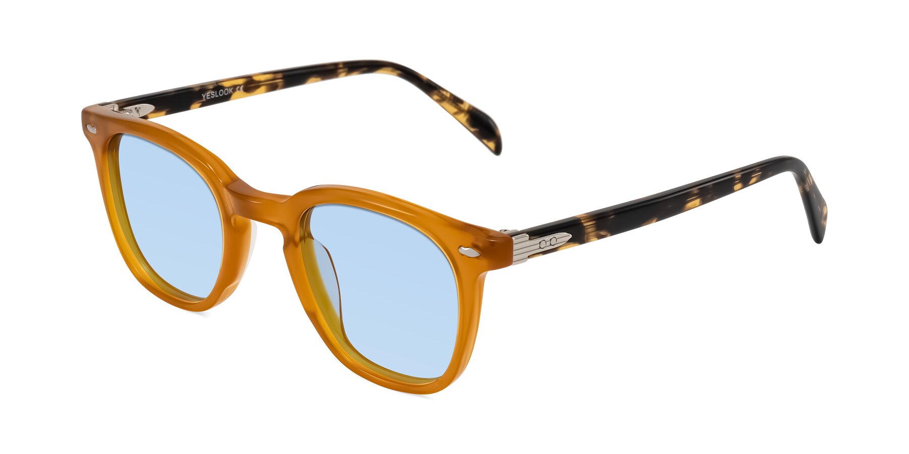 Angle of Palu in Honey/Tortoise with Light Blue Tinted Lenses