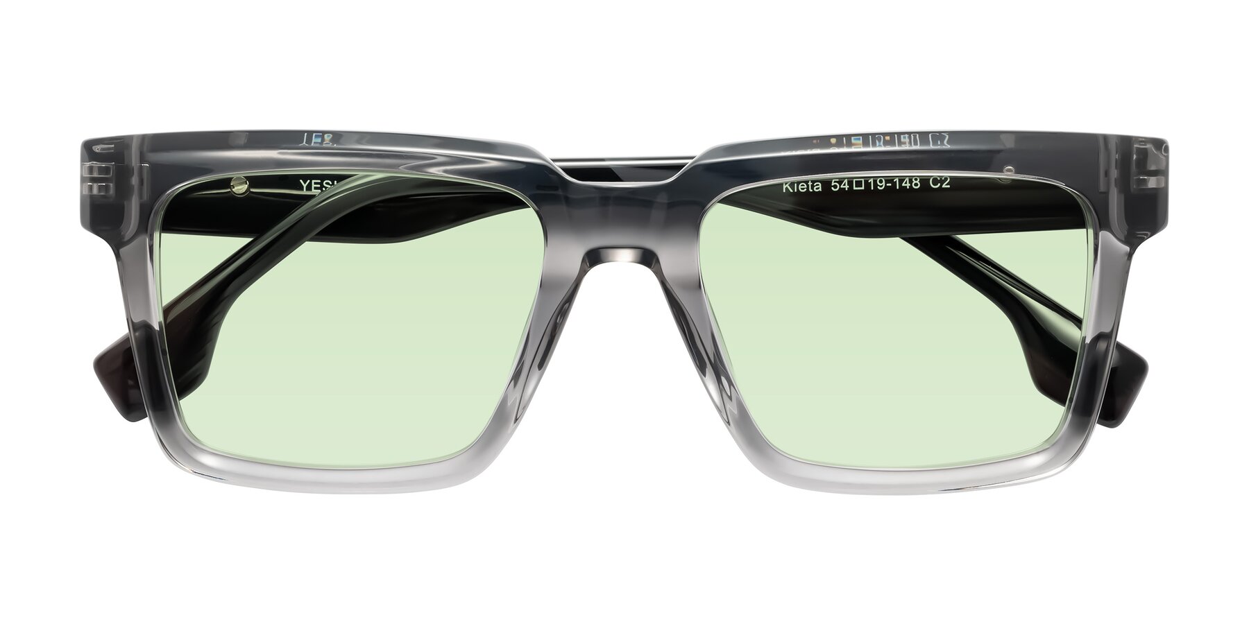 Folded Front of Kieta in Transparent Gray/Gray Brown Striped with Light Green Tinted Lenses