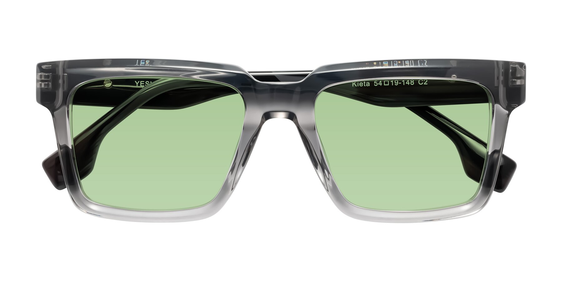 Folded Front of Kieta in Transparent Gray/Gray Brown Striped with Medium Green Tinted Lenses