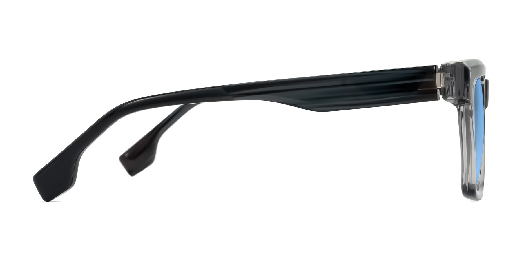Side of Kieta in Transparent Gray/Gray Brown Striped with Medium Blue Tinted Lenses