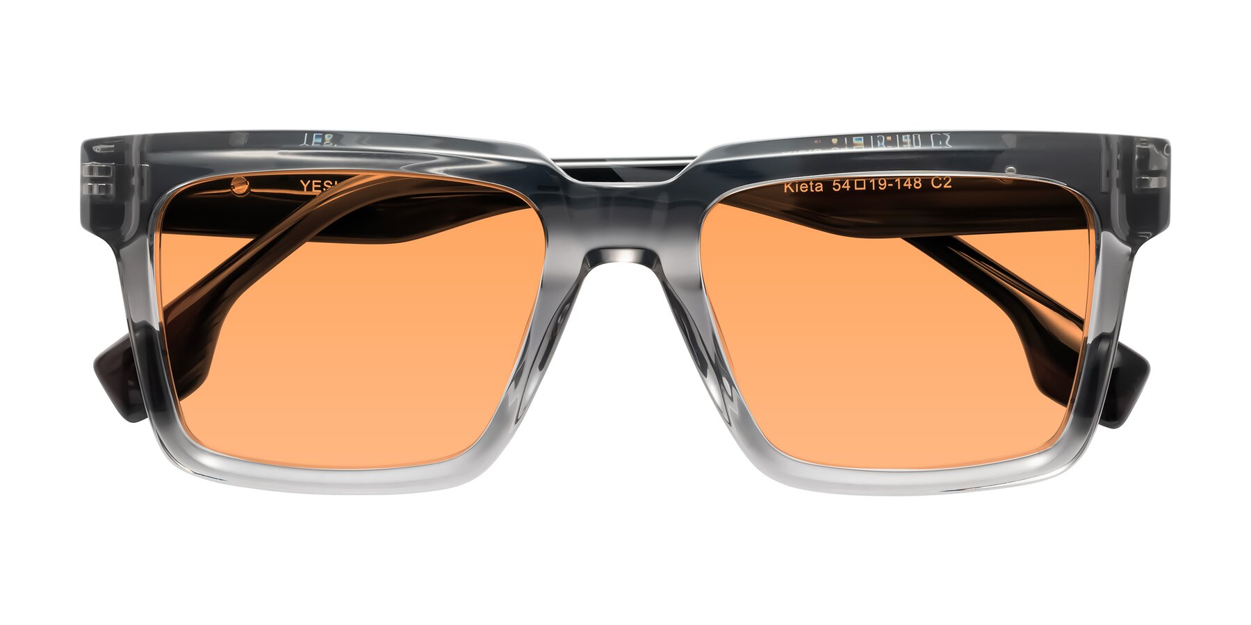 Folded Front of Kieta in Transparent Gray/Gray Brown Striped with Medium Orange Tinted Lenses