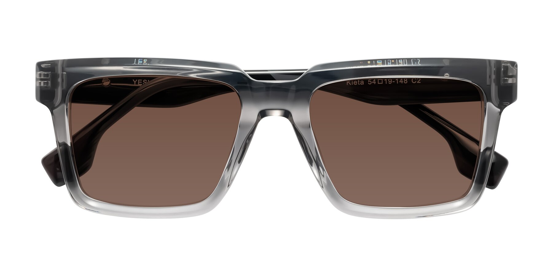 Folded Front of Kieta in Transparent Gray/Gray Brown Striped with Brown Tinted Lenses