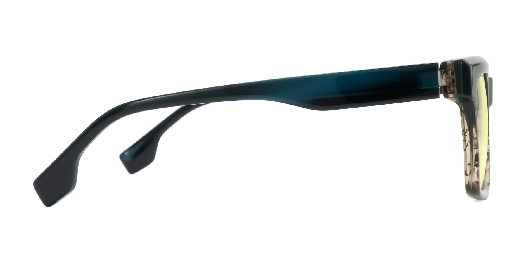 Side of Kieta in Gradient Brown/Teal Striped with Light Yellow Tinted Lenses