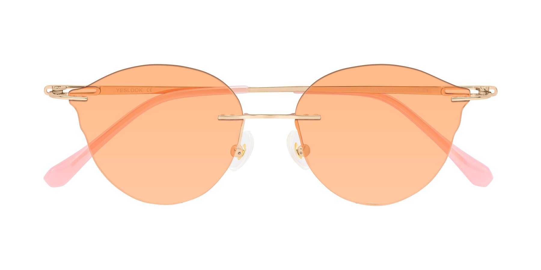 Folded Front of Barlow in Rose Gold/Pink with Light Orange Tinted Lenses