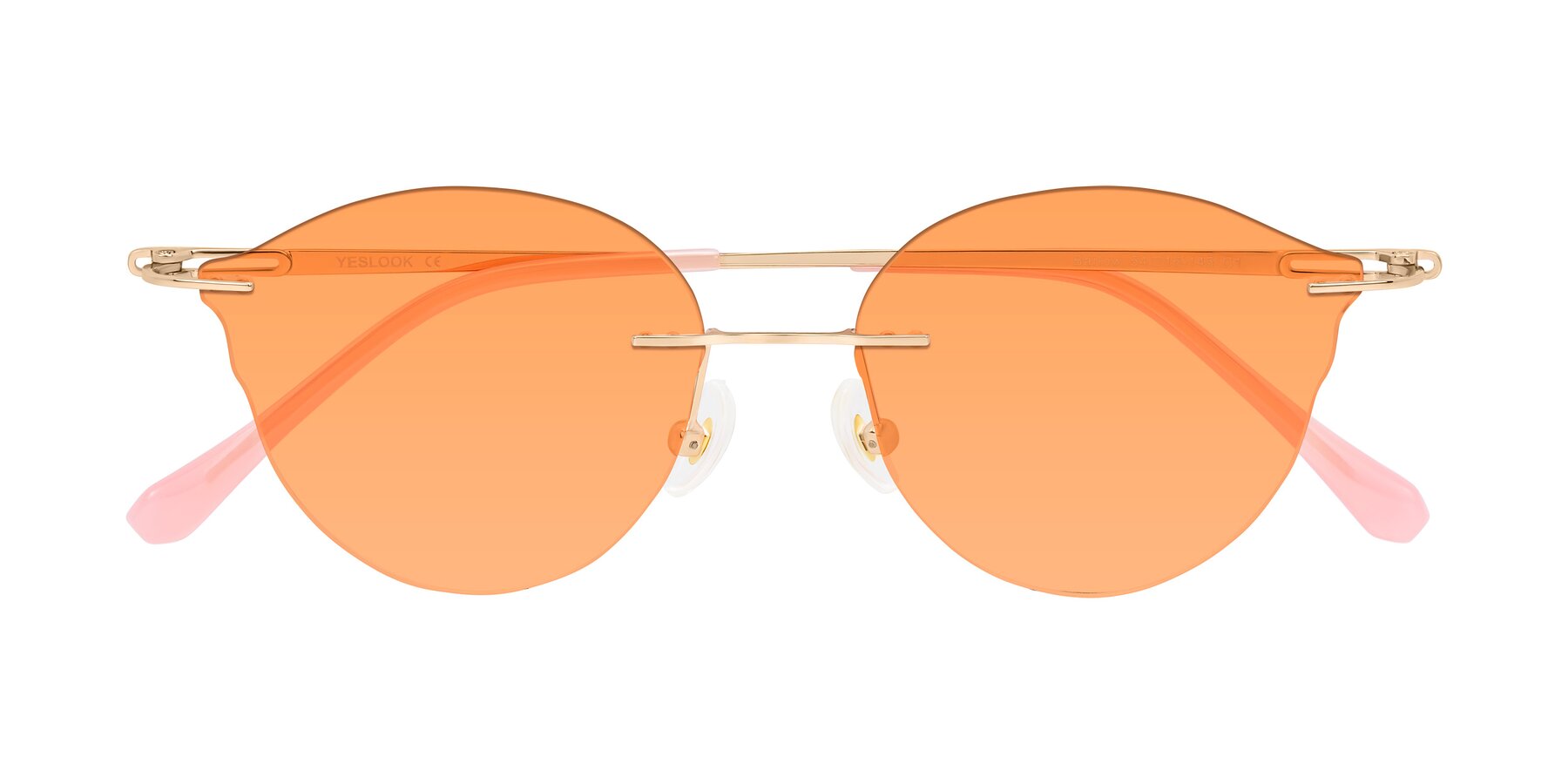 Folded Front of Barlow in Rose Gold/Pink with Medium Orange Tinted Lenses