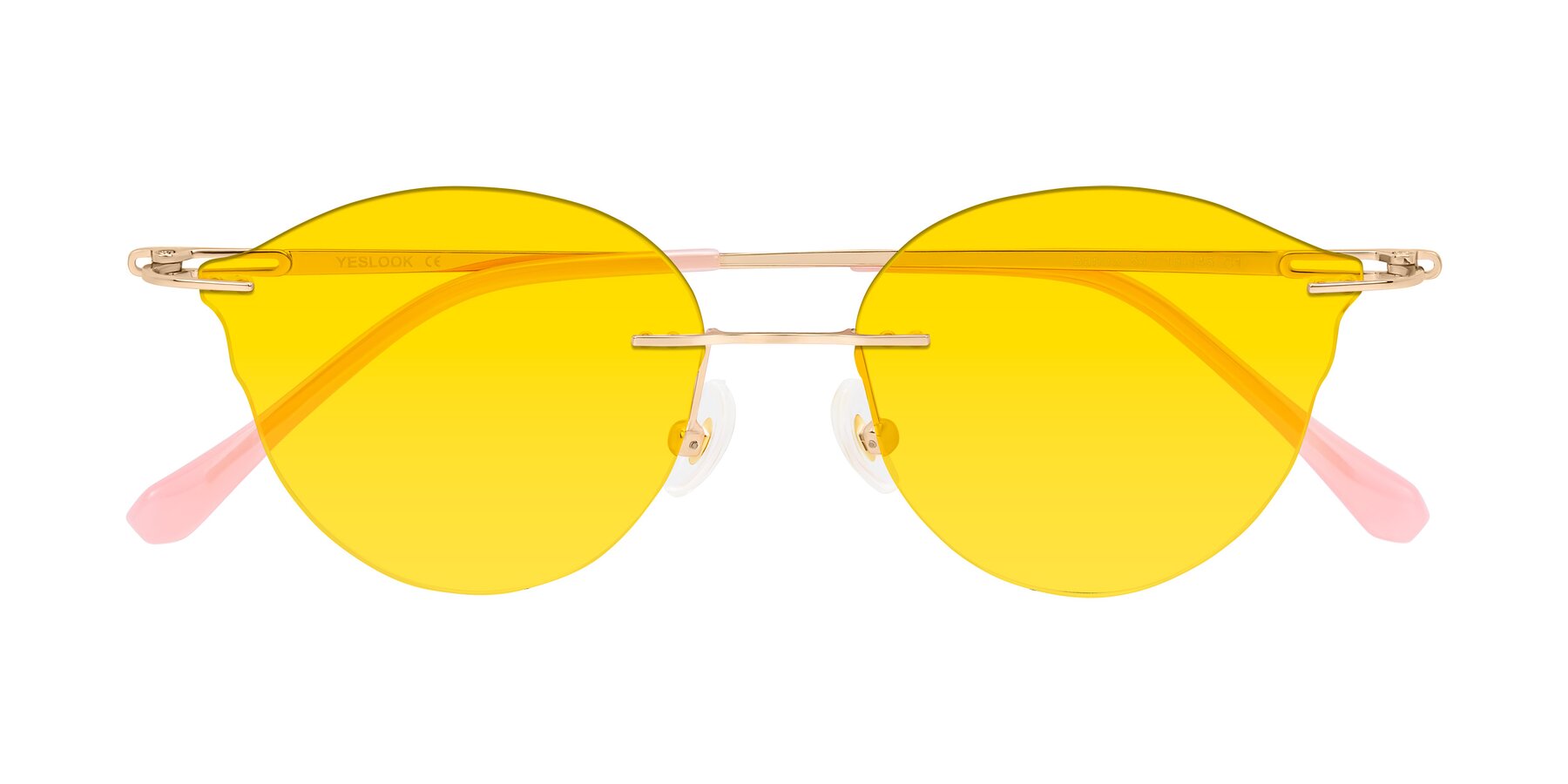 Folded Front of Barlow in Rose Gold/Pink with Yellow Tinted Lenses