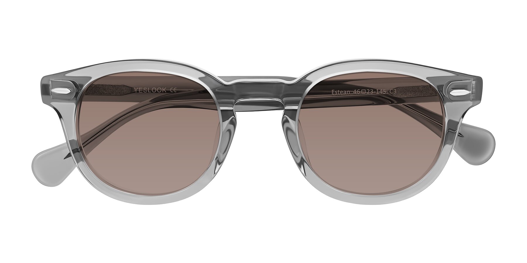Folded Front of Estean in Transparent Gray with Medium Brown Tinted Lenses